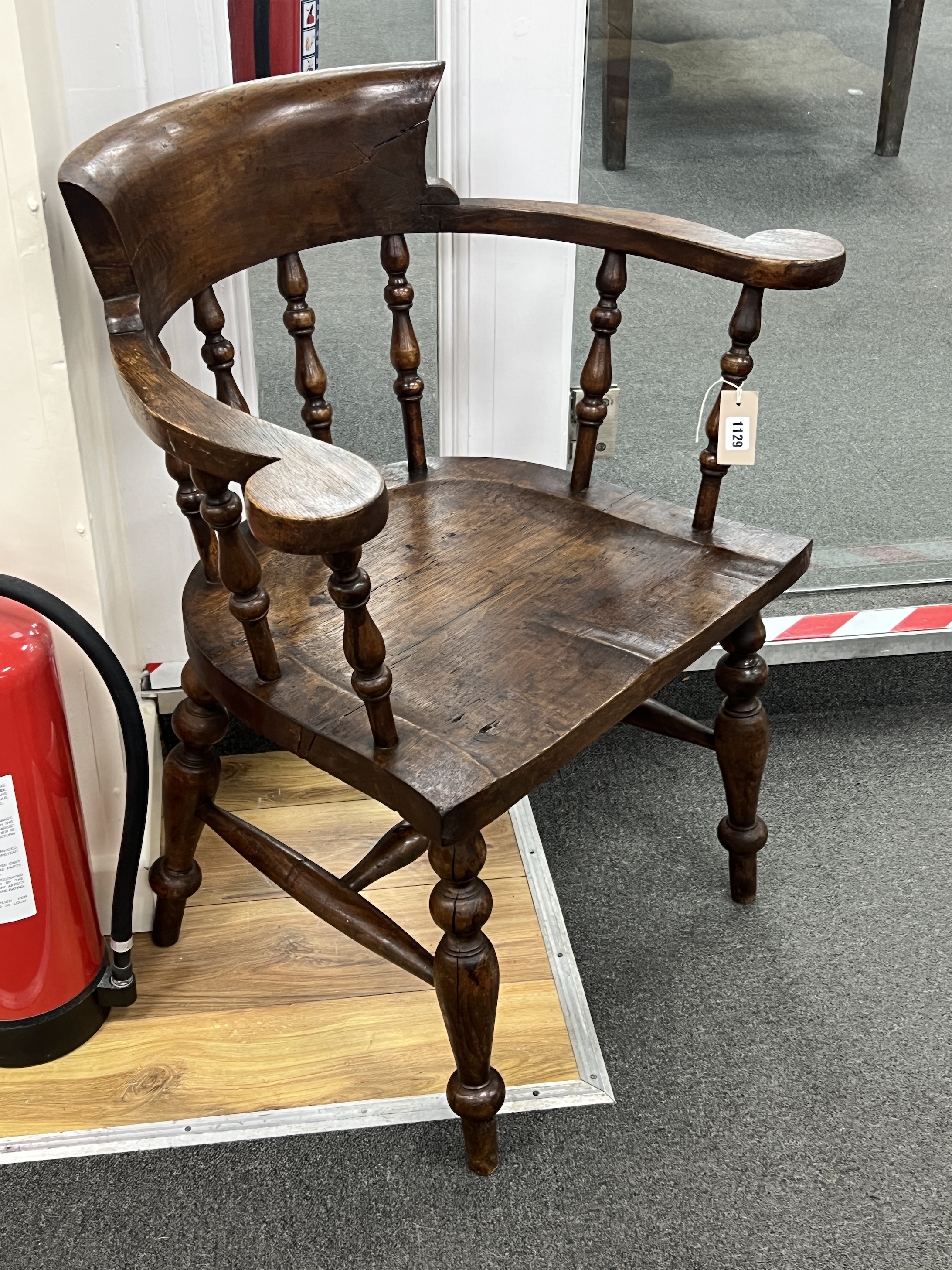 A Victorian style smoker's bow elbow chair, width 72cm, depth 47cm, height 84cm